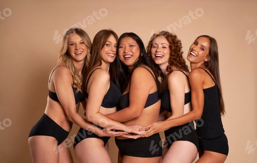 Preview: Group of women in black underwear bonding and smiling towards the camera