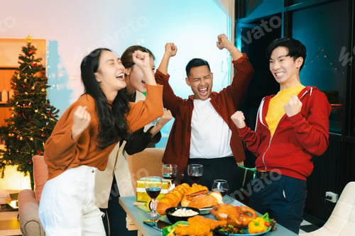 Preview: Dinner and group of people celebrating together at Merry Christmas and New Year.