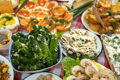 Preview: A lot of different food on the Banquet table.A large number of prepared dishes on the table.Holiday