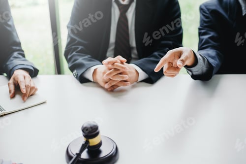 Preview: Businessmen and lawyers meeting and discuss lawsuit in the office.