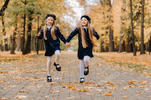 Preview: Happy children are running in a beautiful autumn park