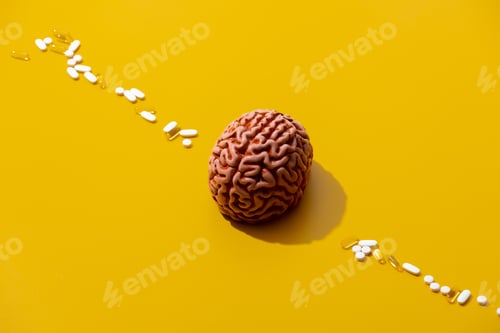 Preview: Man brain and pills around on yellow background