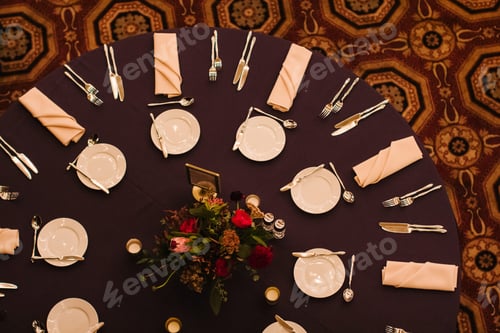 Preview: overhead view of a round table decorated and setup