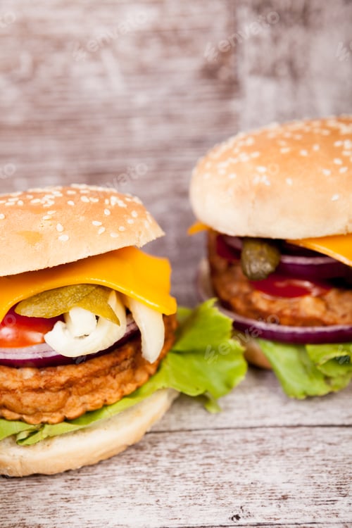 Preview: Delicious fresh home made burgers on wooden plate