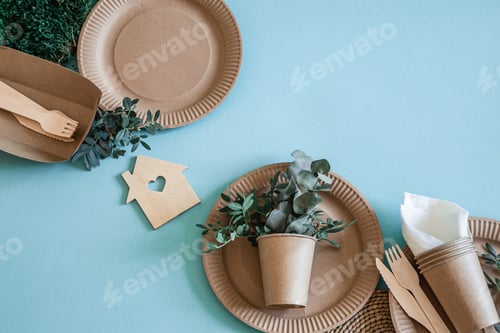 Preview: Eco-friendly disposable utensils made of bamboo wood and paper on a trending background.