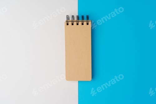Preview: Blank page of notepad on blue nad white paper background