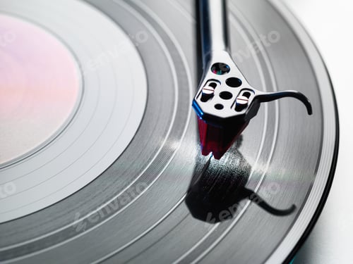 Preview: Overhead close up of turntable stylus playing a vinyl record