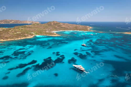 Preview: Aerial view of luxury yachts and boats on blue sea, island