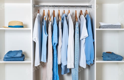 Preview: Modern white wardrobe with stylish spring and summer clothes and accessories.