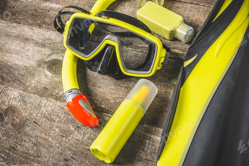 Preview: Snorkeling gear displayed on wooden surface for underwater exploration