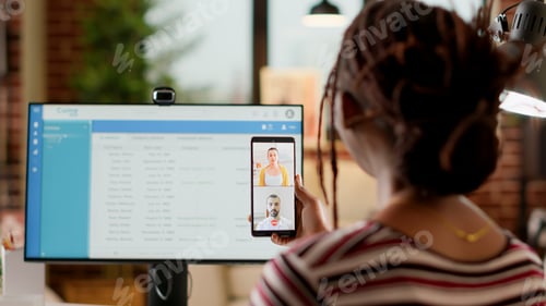 Preview: Business student attending videocall meeting with colleagues