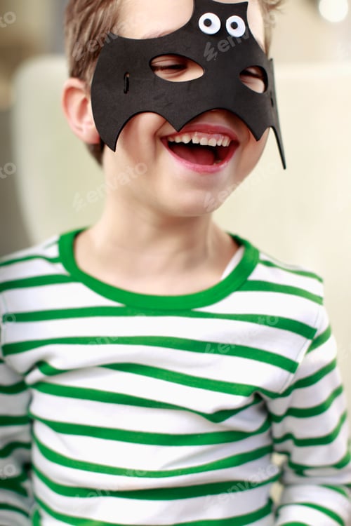 Preview: Portrait of young boy in bat mask