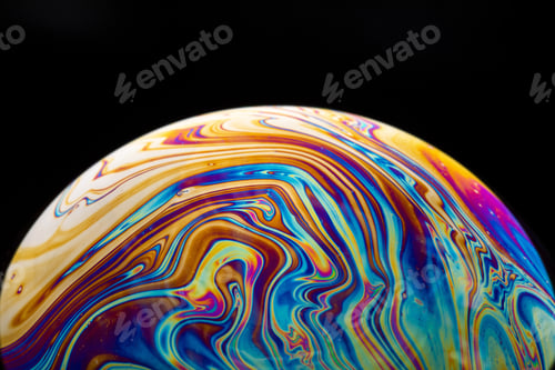 Preview: Bubble in rainbow colors isolated on a black background with space for text