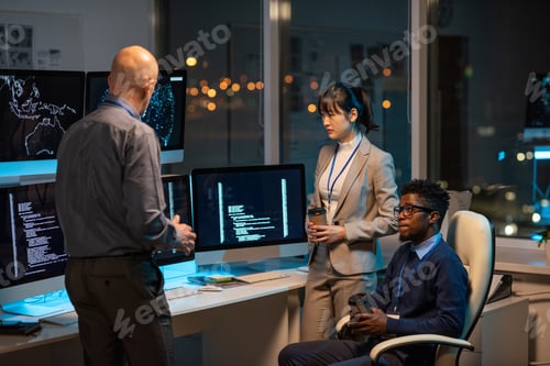 Preview: Group of intercultural co-workers in formalwear discussing working points