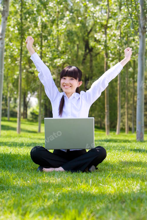Preview: Woman in park with laptop