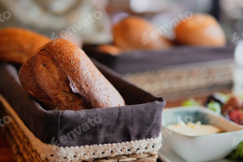 Preview: Freshly baked bread rolls served in a cozy restaurant