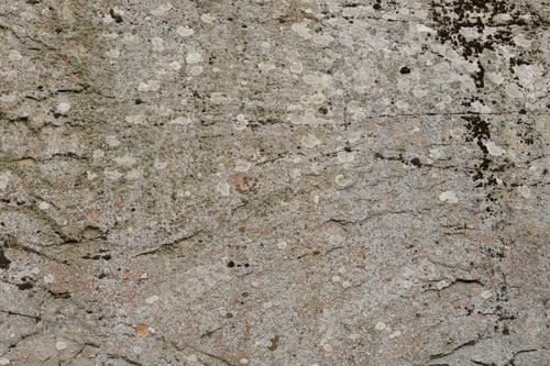 Preview: Closeup of the rough stone texture of a big rock surface for natural background