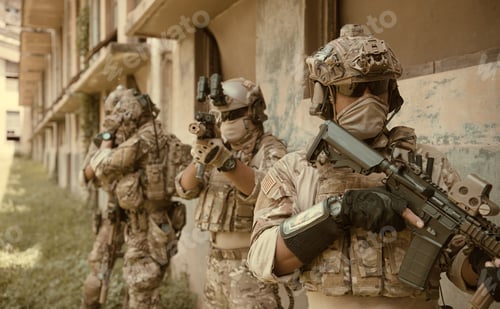 Preview: Professional marine soldiers training with weapon on a military range.