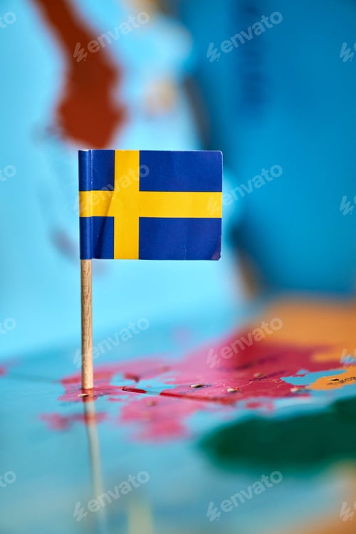 Preview: Swedish Flag on Colorful World Map Close Up