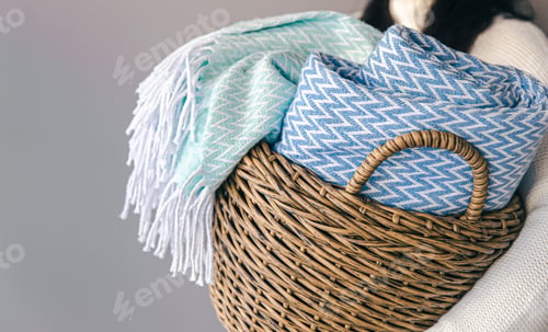 Preview: Textured plaids in a wicker basket on a gray background.