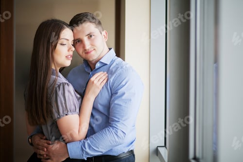 Preview: Portrait of a sensual brunette and handsome businessman. Office romance concept