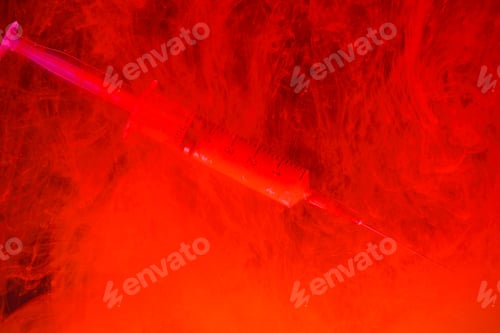 Preview: Syringe With Blood And Blood On A Black Background