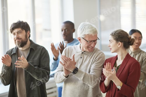 Preview: Diverse Audience Applauding at Seminar