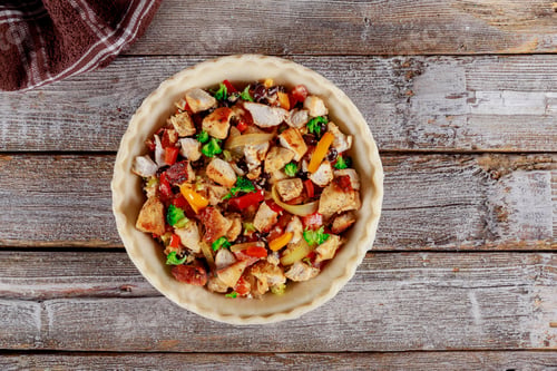 Preview: American homemade chicken pot pie in the baking dish on the table view from above