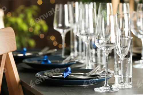 Preview: Table setting with empty glasses, plates and cutlery indoors