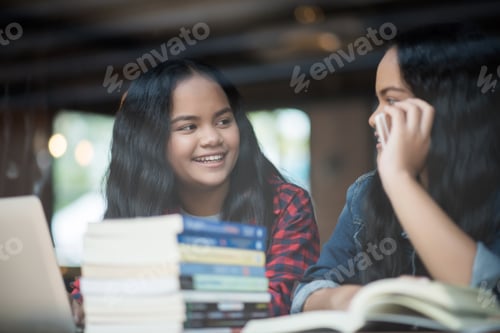 Preview: Group of happy friends student talking about knowledge in cafe