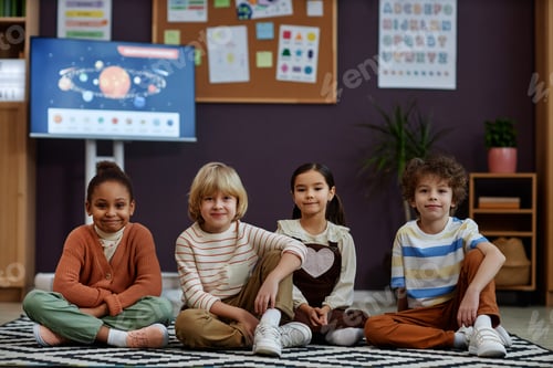 Preview: Diverse group of little kids sitting on floor in preschool class