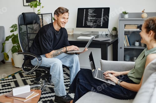 Preview: Colleagues using computers at work