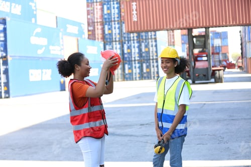 Preview: Foreman control loading Containers box from Cargo freight ship for import export.