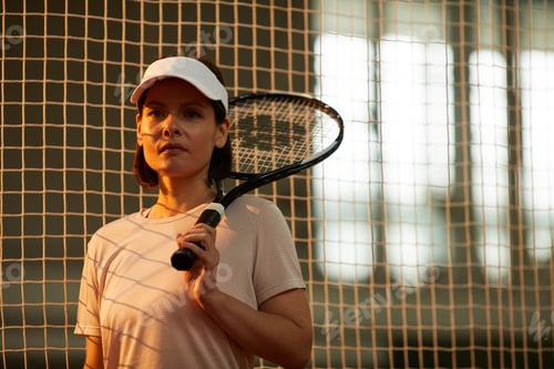 Preview: Confident tennis player in cap