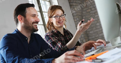 Preview: Portrait of young designers working on computer