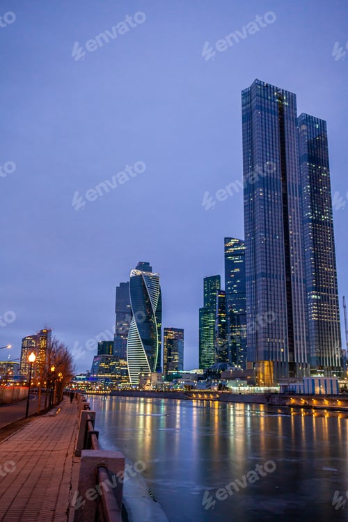Preview: Moscow City skyscraper buildings with windows night view.