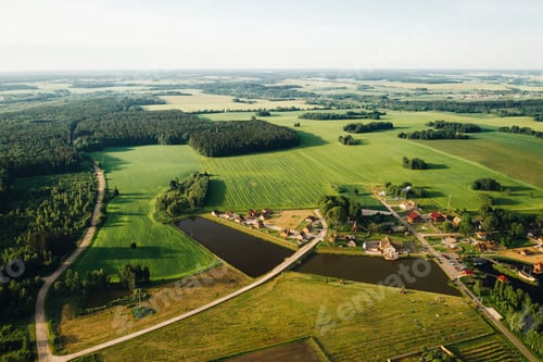 Preview: view from the height of the Lake in a green field in the form of a horseshoe and a village in the
