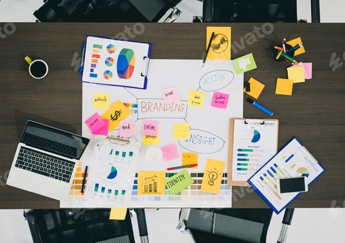 Preview: creative designer brainstorming ducument on wood table in meeting room.