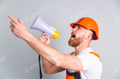 Construction Worker Shouting Through Megaphone to Team