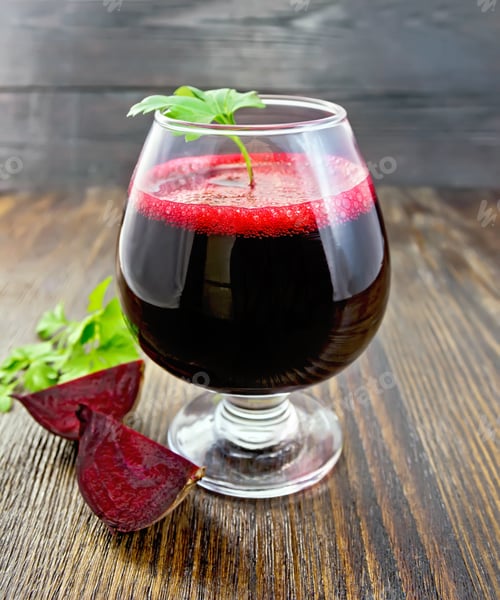 Preview: Juice beet in wineglass on dark board