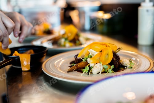 Preview: Cropped image of chef preparing dish in Sky bar restaurant