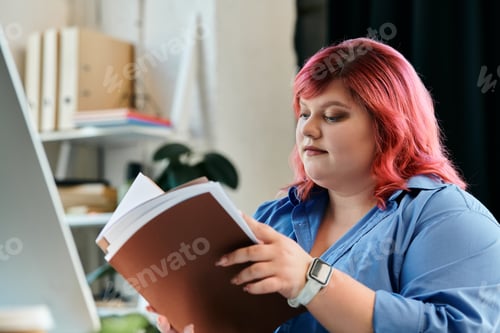 Preview: A Moment of Focus: Woman Reading in an Office
