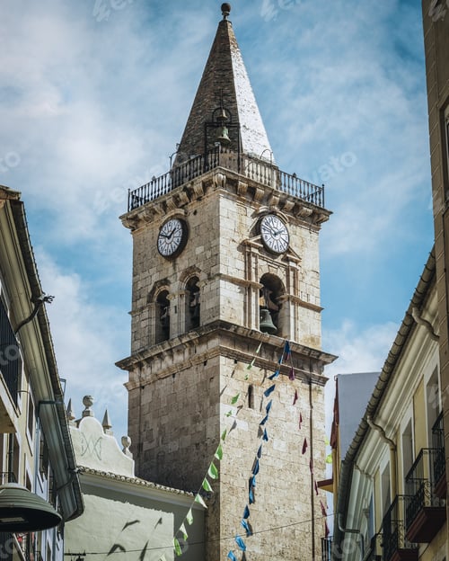 Preview: The tower bells and big clock of Saint Santiago church in Villena city, Alicante, Spain