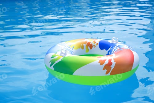 Preview: Inflatable ring in swimming pool on sunny day