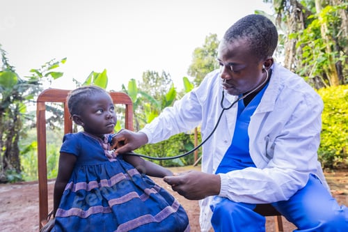 Preview: African young Pediatrician visiting at home a sick toddler. Pediatrics concept