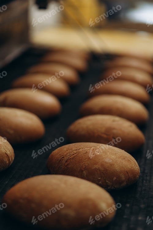 Preview: A lot of bread prepare to move on in the shelf. Bread bakery food factory production with fresh