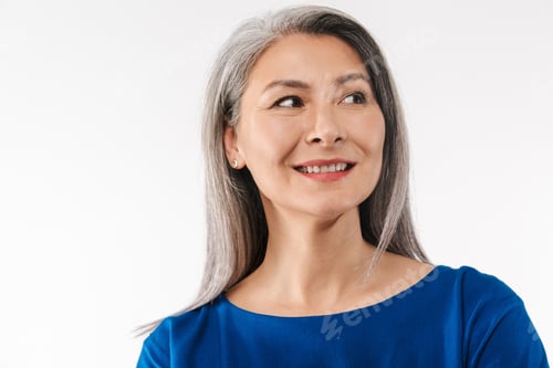 Preview: Image of adult woman with long gray hair looking aside at empty space