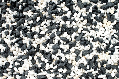 Preview: Top view of the decorative natural colorful gravel on the grave. Close-up of the stones.