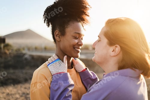 Preview: Happy women gay couple having tender moment outdoor - Lgbt and love concept