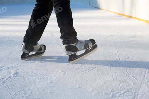 Preview: Adult Men's Ice Skates close-up on Ice in Winter outdoor on the move
